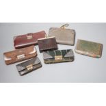 Five assorted early 20th century silver mounted leather purses including Art Nouveau, a similar