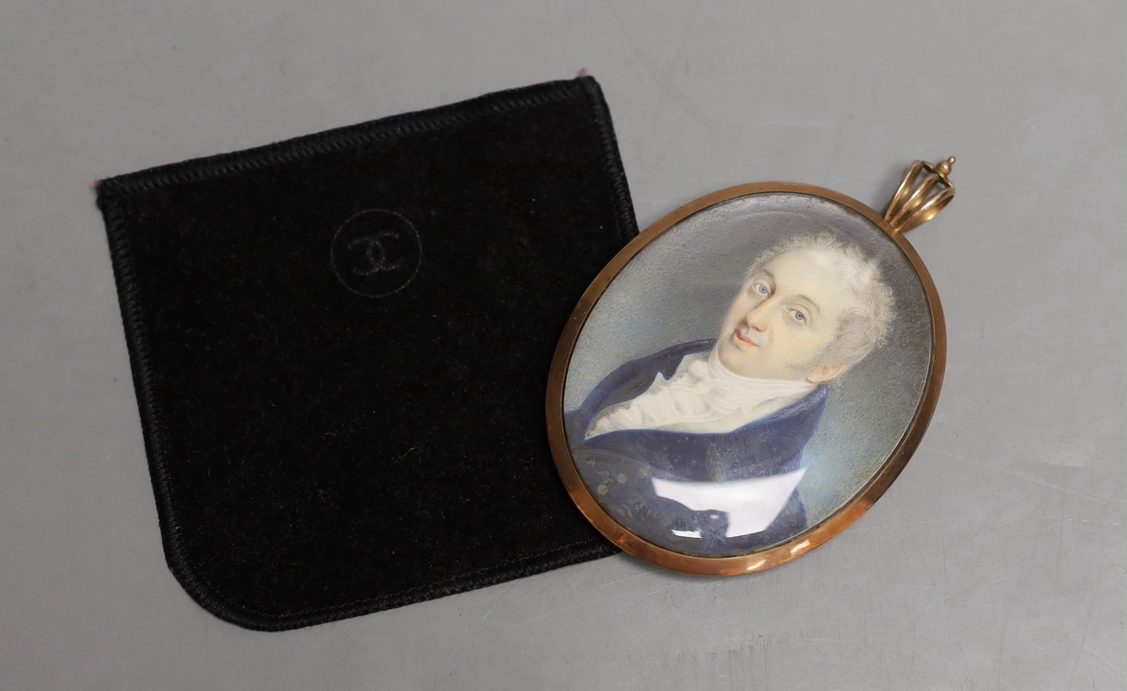 A late Georgian portrait miniature of a gentleman, with memorial hair plaque and monogram on - Image 3 of 3