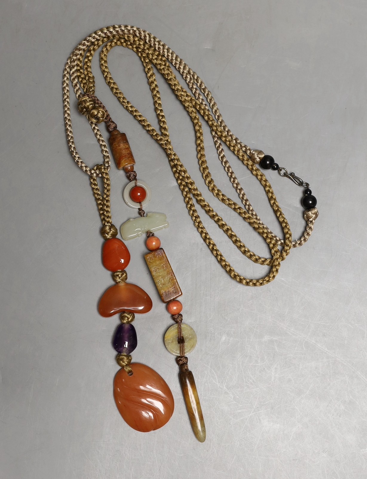 Kai Yin Lo, Hong Kong, A jade and coral mounted necklace and an agate and amethyst mounted necklace