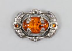 A Georg Jensen 925 sterling and amber set oval brooch, no. 169, 52mm.
