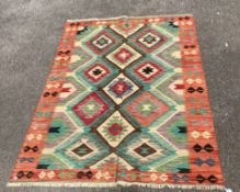 An Anatolian design polychrome flatweave Kilim carpet, 212 x 152cm