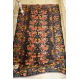 A Kirman style blue ground floral rug, 160 x 105cm