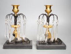 A pair of gilt bronze and glass lustre drop 'sphinx' candlesticks, 21cm