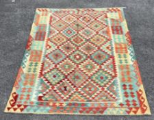 An Anatolian style polychrome Kilim flatweave carpet, 254 x 185cm