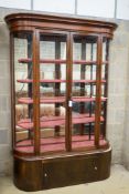 A Victorian mahogany shop display cabinet on later base, width 150cm, depth 32cm, height 209cm