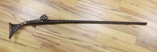 An Eastern antique flintlock rifle - 152cm long