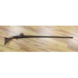 An Eastern antique flintlock rifle - 152cm long