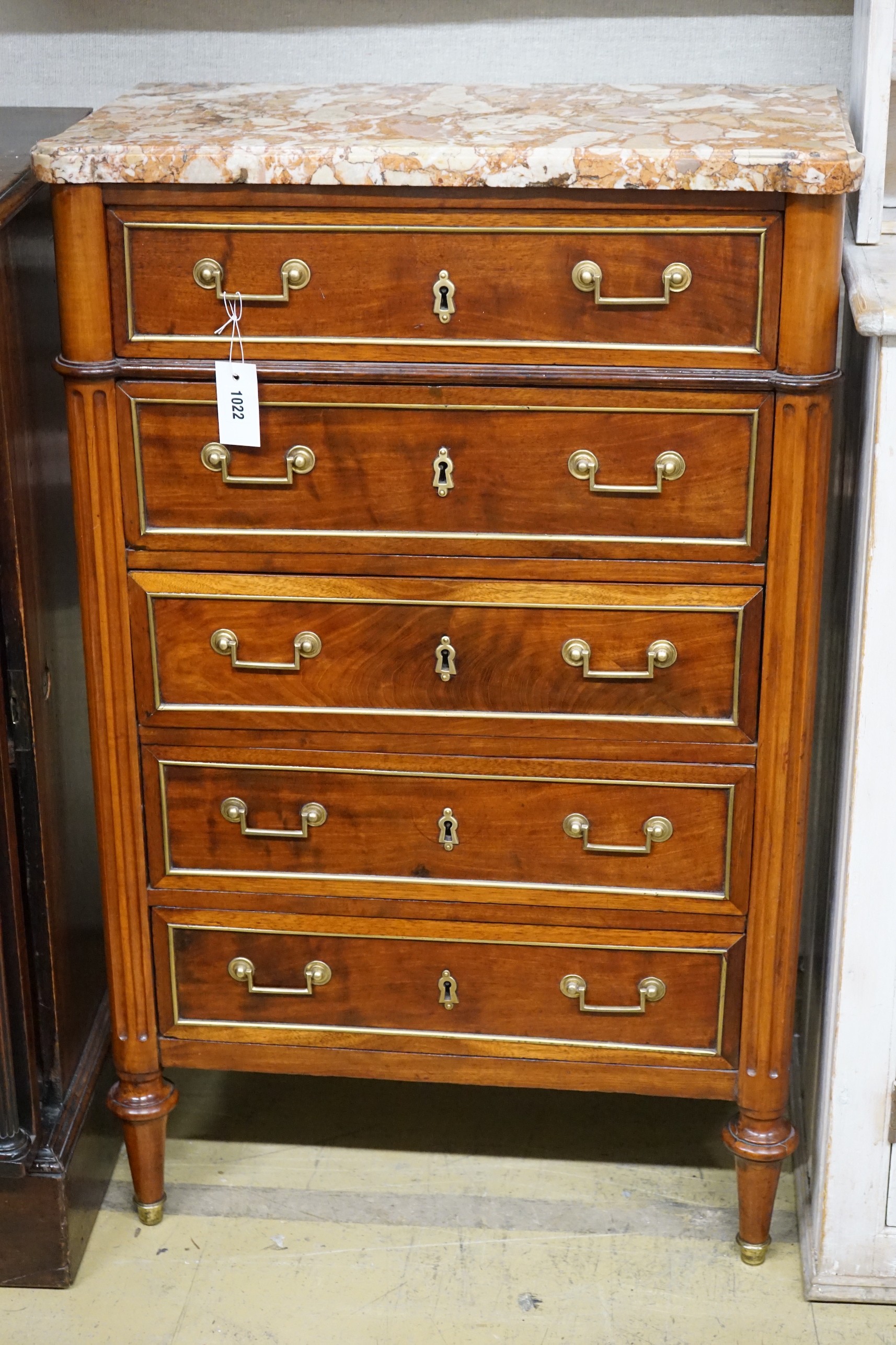 A late 19th/early 20th century French brass mounted mahogany marble top five drawer chest, width