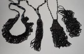 Four assorted French jet necklaces, largest approx. 104cm.