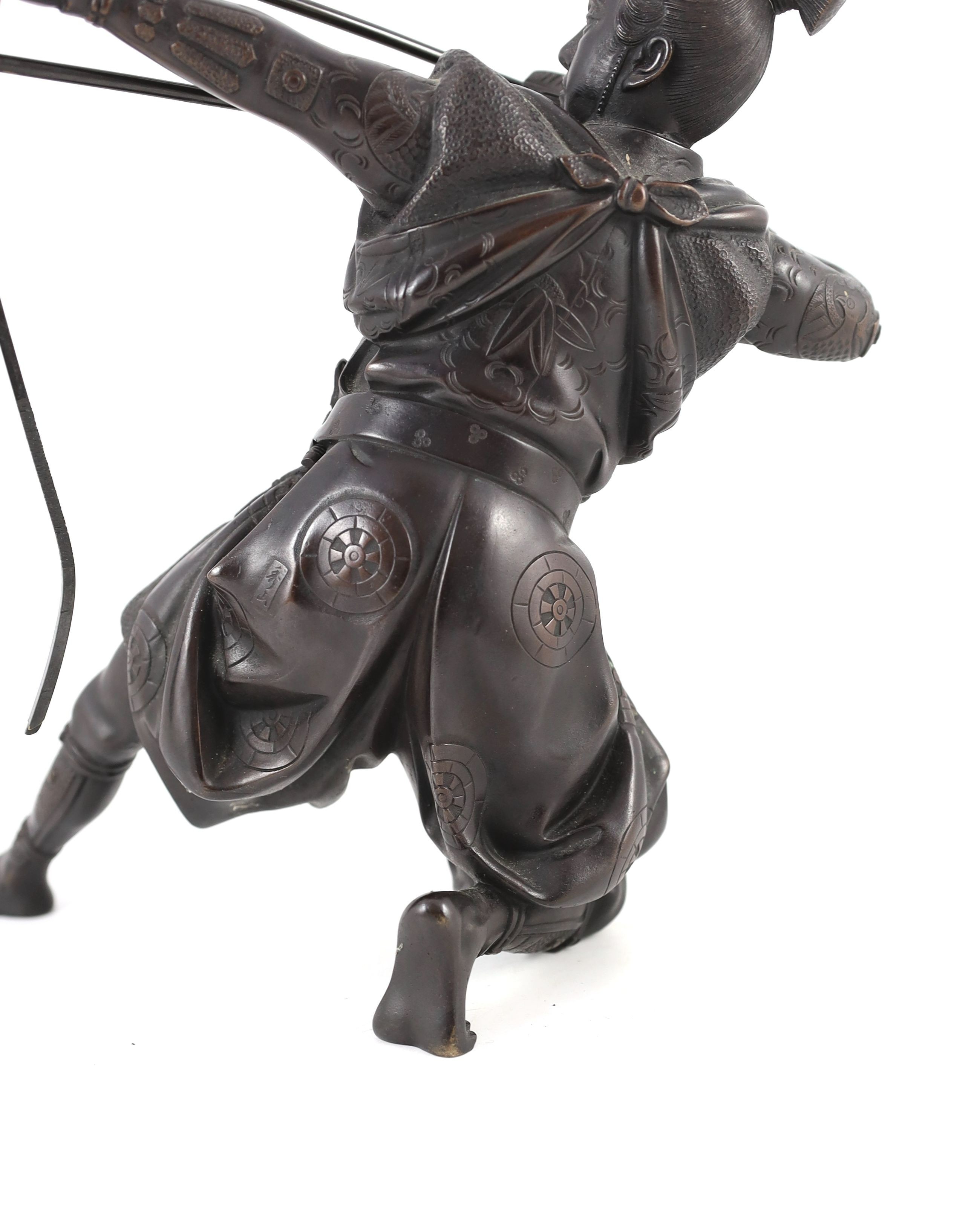 A Japanese bronze figure of a kneeling archer, Meiji period, signed to a raised tablet ‘…zan’ 40 - Image 6 of 7