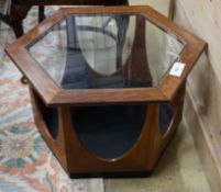 A mid century design hexagonal teak brass top coffee table, width 63cm, height 42cm