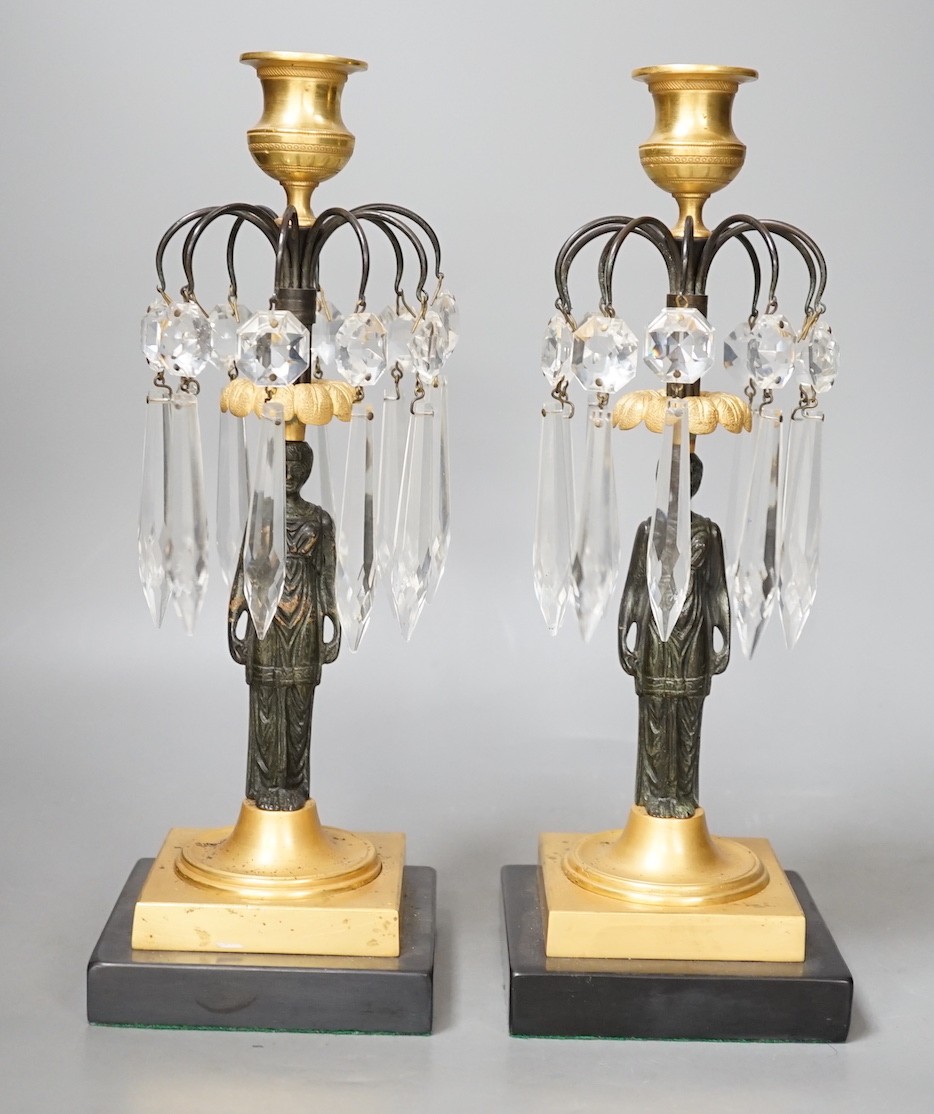 A pair of figural lustre drop candlesticks - 29cm tall