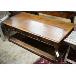 An 18th century style rectangular oak two tier coffee table, length 130cm, depth 62cm, height 50cm