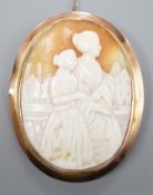 A 9ct mounted oval cameo shell brooch, carved with two ladies in a townscape, 58mm, gross weight