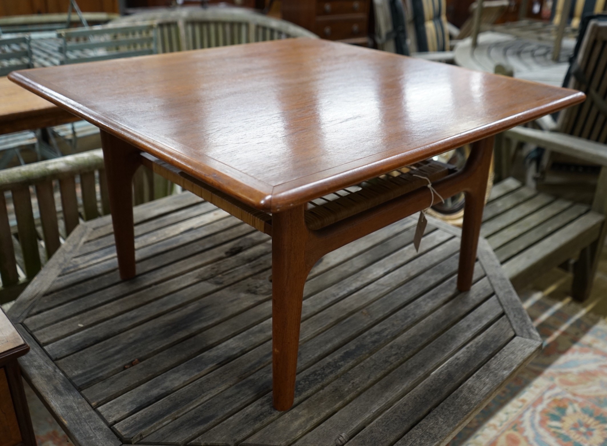 A mid century design Trioh Mobler Danish square teak coffee table with cane undertier, width 74cm,