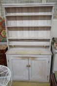 A Victorian painted pine dresser with later boarded rack, length 125cm, depth 42cm, height 215cm