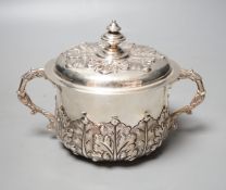 A George V embossed Brittania standard silver two handled presentation bowl and cover,