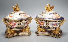 A pair of unusual English porcelain Imari sauce tureens, covers and stands, possibly Coalport c.