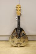 An Ashbury mandolin ‘Resonator’ with fitted, padded case,mandolin 69 cms high.