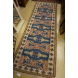 A Caucasian style blue ground runner, 264 x 90cm