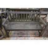 A weathered teak garden bench, length 122cm, depth 54cm, height 83cm