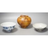 Two Chinese Ming blue and white bowls and a straw glazed jar of Martaban type - tallest 13cm