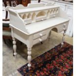 A Victorian style painted pine kneehole dressing table, width 128cm, depth 52cm, height 109cm