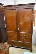 A 1920's mahogany press cupboard with part dummy drawer front over a single drawer, width 120cm,