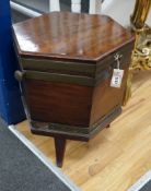 A George III mahogany and brass bound hexagonal cellaret on a reduced stand, width 43cm, height