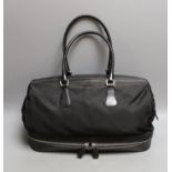 A Prada bowling bag style with zip up compartment