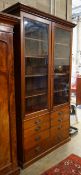 A late Victorian glazed mahogany cabinet fitted seven drawers, width 128cm, depth 56cm, height