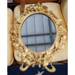 A Victorian oval carved giltwood wall mirror, width 49cm, height 66cm