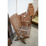 Five assorted teak folding garden chairs