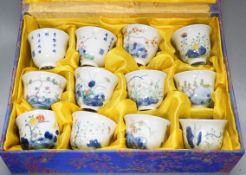 A Chinese boxed set of twelve wucai ‘month’ cups