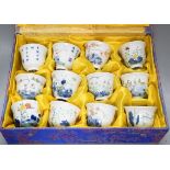 A Chinese boxed set of twelve wucai ‘month’ cups