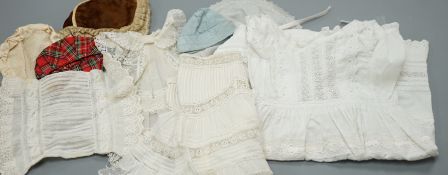 Assorted white cotton dolls dresses, petticoats, one coat and three hats and a child's shoe