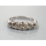 A modern platinum and graduated five stone diamond set half hoop ring, size P/Q, gross weight 6