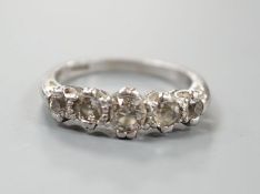 A modern platinum and graduated five stone diamond set half hoop ring, size P/Q, gross weight 6