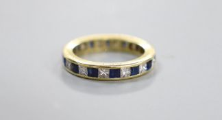 A yellow metal, sapphire and diamond set full eternity ring, the side of the shank engraved 'Thou