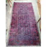 A Belouch rug and a North West Persian rug, larger 220 x 110cm