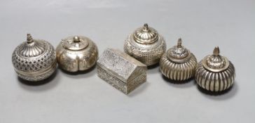 Five assorted 20th century Indian white metal circular boxes and covers including betel nut boxes