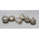 Five assorted 20th century Indian white metal circular boxes and covers including betel nut boxes