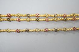 A modern Thai yellow metal and gem set spherical link necklace, 72cm and a similar bracelet