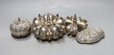 Two 20th century Indian white metal segmental spice boxes, decorated with peacocks, largest 13.5cm