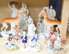 A collection of twelve Victorian Staffordshire flat back figures and groups,tallest 31 cms high.