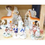 A collection of twelve Victorian Staffordshire flat back figures and groups,tallest 31 cms high.