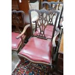 A set of eight Chippendale revival mahogany dining chairs with pierced splats, two with arms