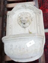 A reconstituted stone garden fountain with lion mask spout, height 75cm