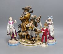 A pair of KPM style porcelain figures of a maiden and a gallant, 22cm, a Capo di Monte figure group,