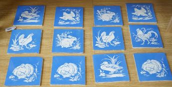 A collection of twelve Mintons China Works blue and white bird tiles,5cms x 5cms square (each
